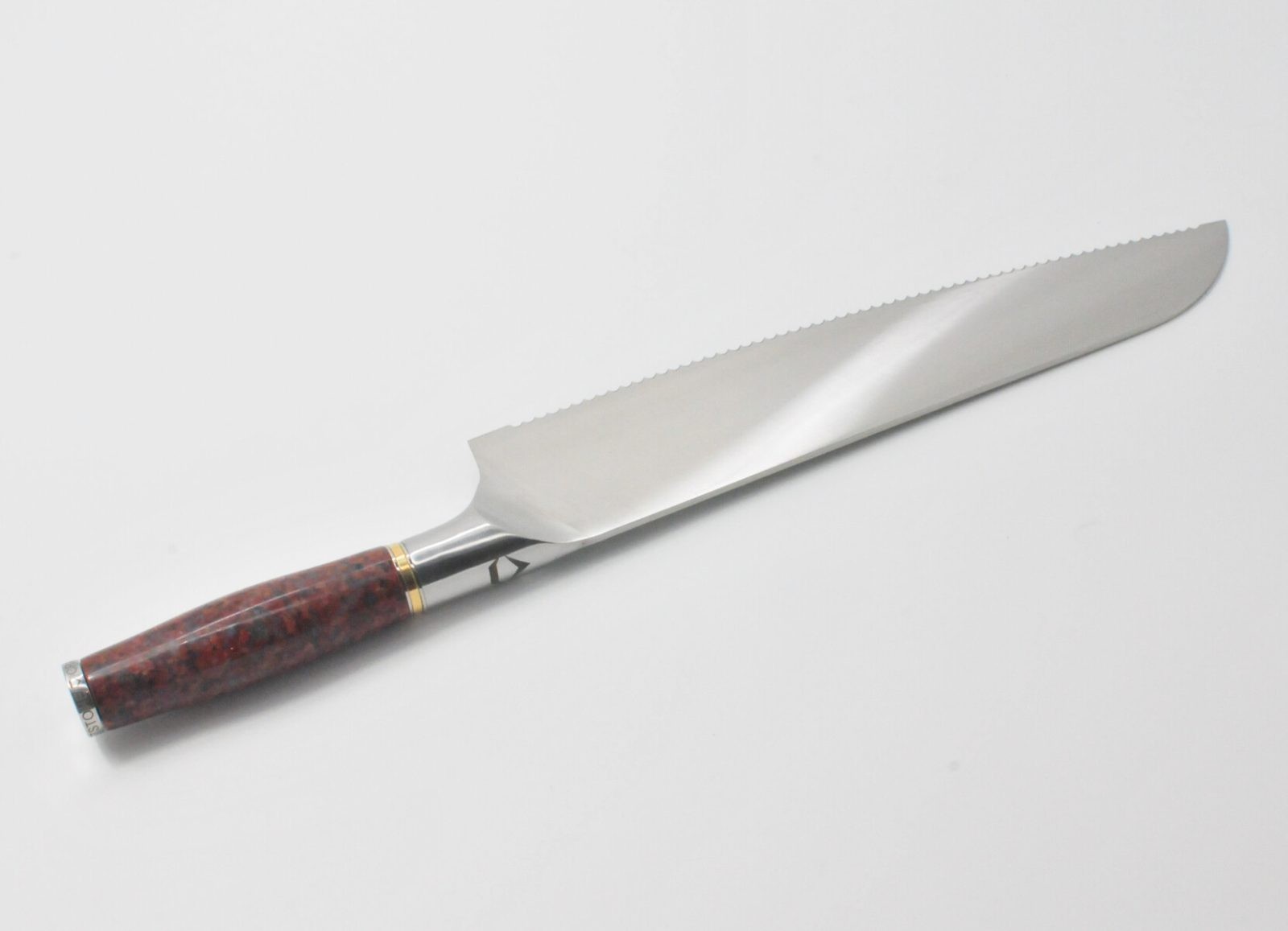 10 Inch Bread Knife with a Red Granite Handle, a Garnet Colored Cubic Zirconia Stone at the Back of the Knife and Brass and Stainless Steel Decorative Rings