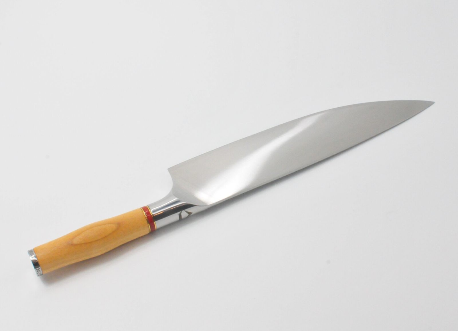 10 Inch Chef Knife with a Torrefied Maple Handle, a Garnet Colored Cubic Zirconia Stone at the Back of the Knife and Brass and Red Jasper Decorative Rings