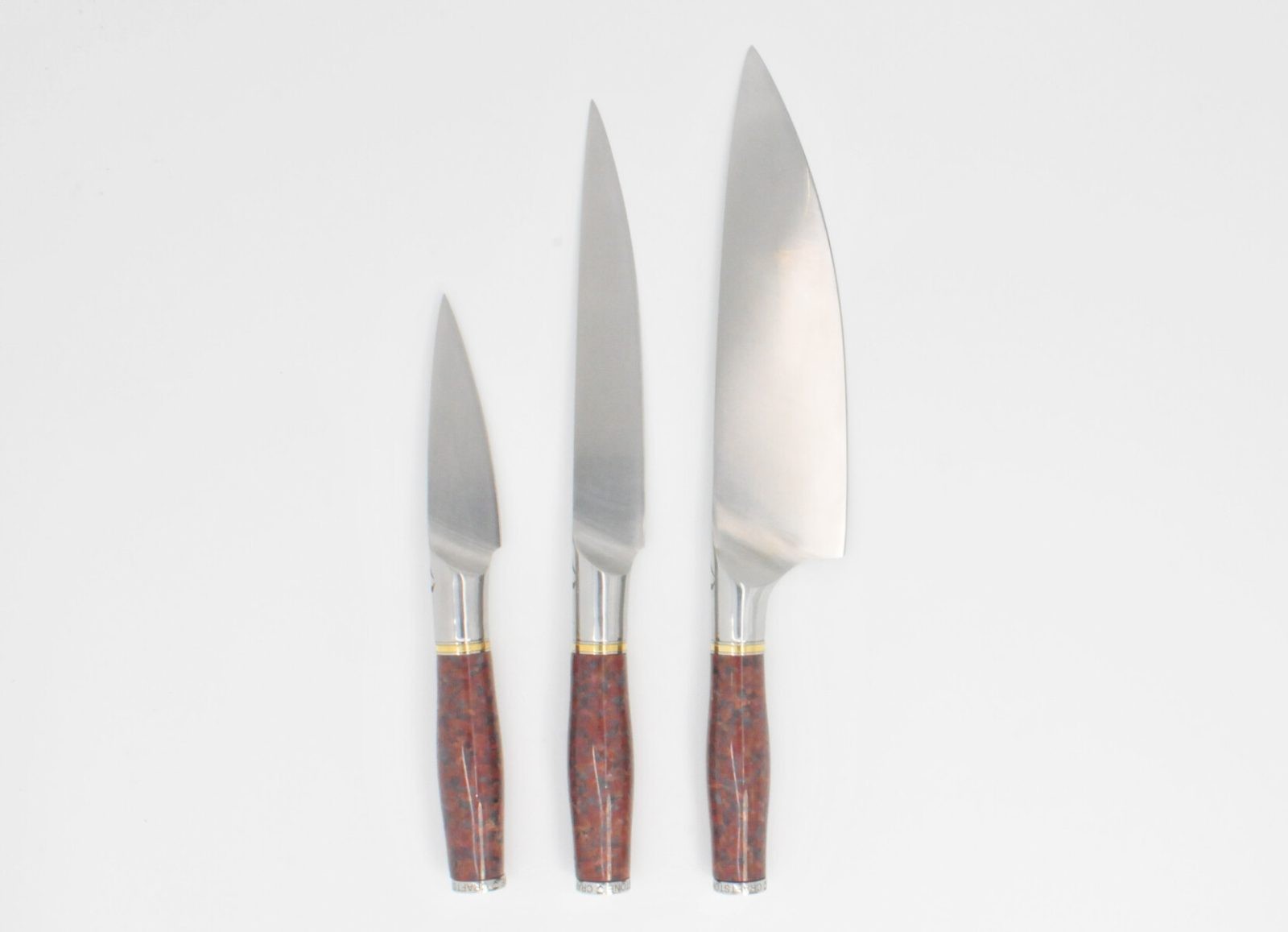 3 Knife Set with a Red Granite Handle, a Garnet Colored Cubic Zirconia Stone at the Back of the Knife and Brass and Stainless Steel Decorative Rings
