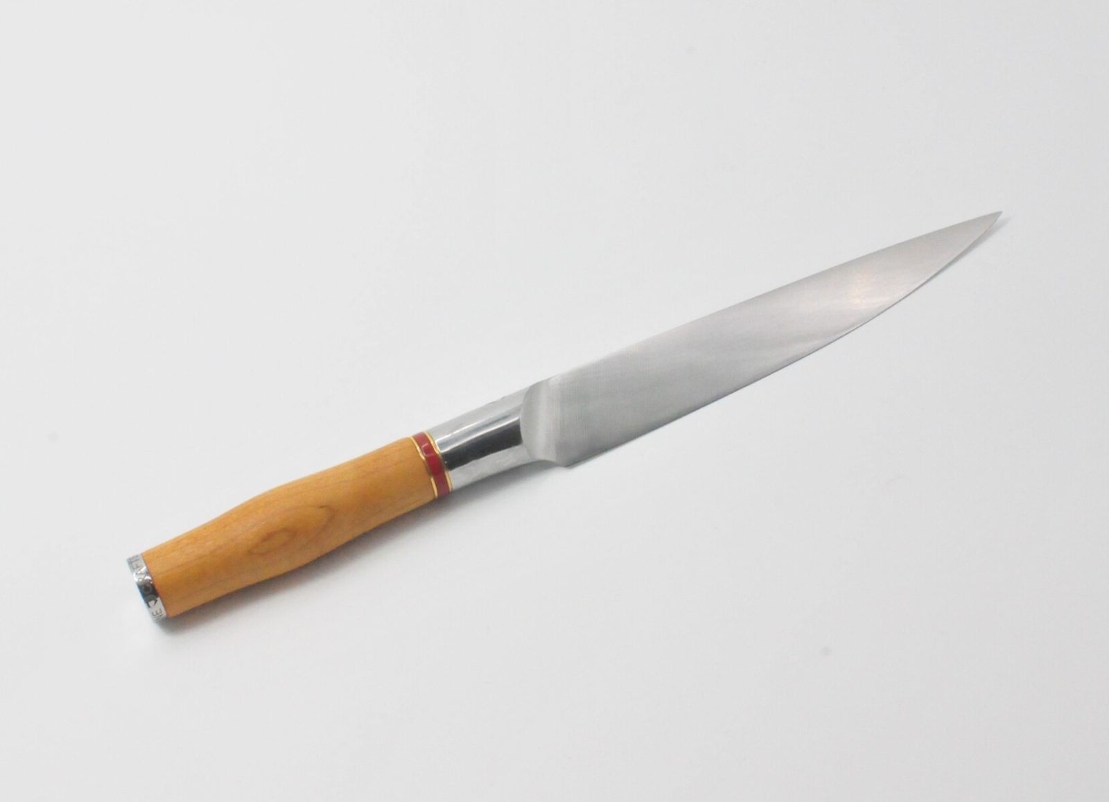 7 Inch Utility Knife with a Torrefied Maple Handle, a Garnet Colored Cubic Zirconia Stone at the Back of the Knife and Brass and Red Jasper Decorative Rings
