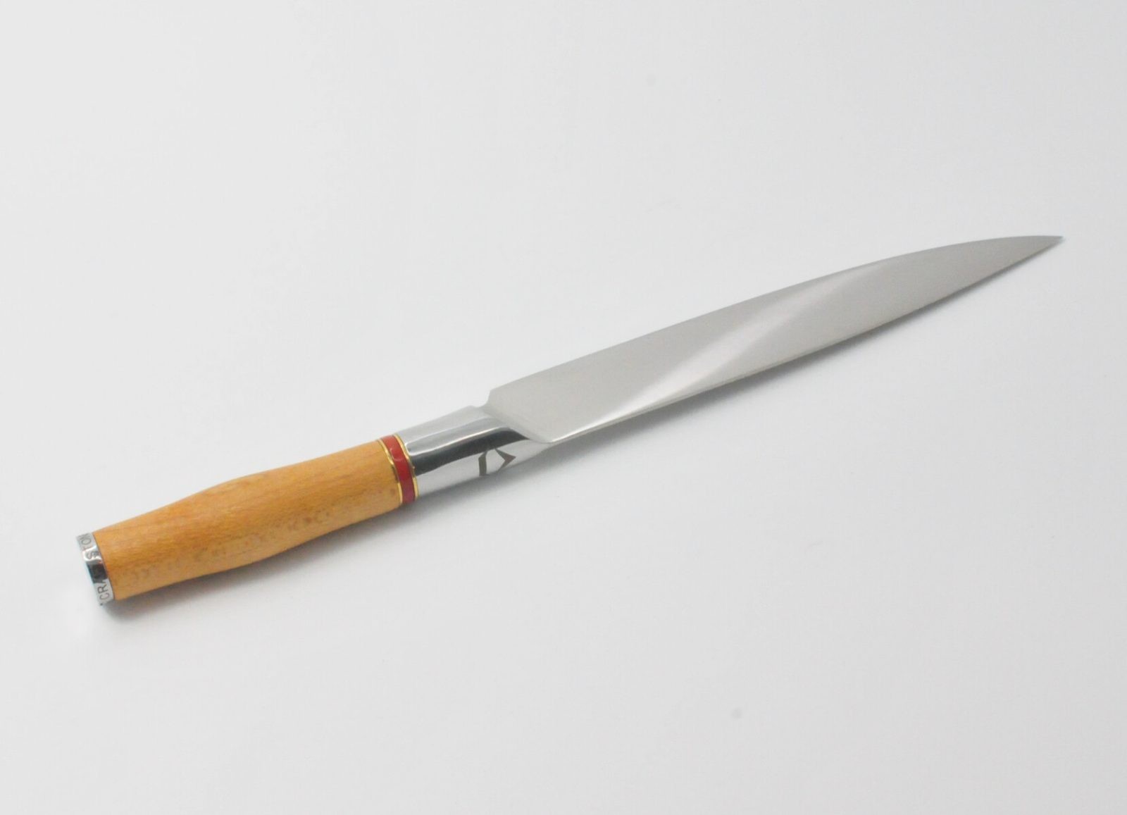 8 Inch Carving Knife with a Torrefied Maple Handle, a Garnet Colored Cubic Zirconia Stone at the Back of the Knife and Brass and Red Jasper Decorative Rings
