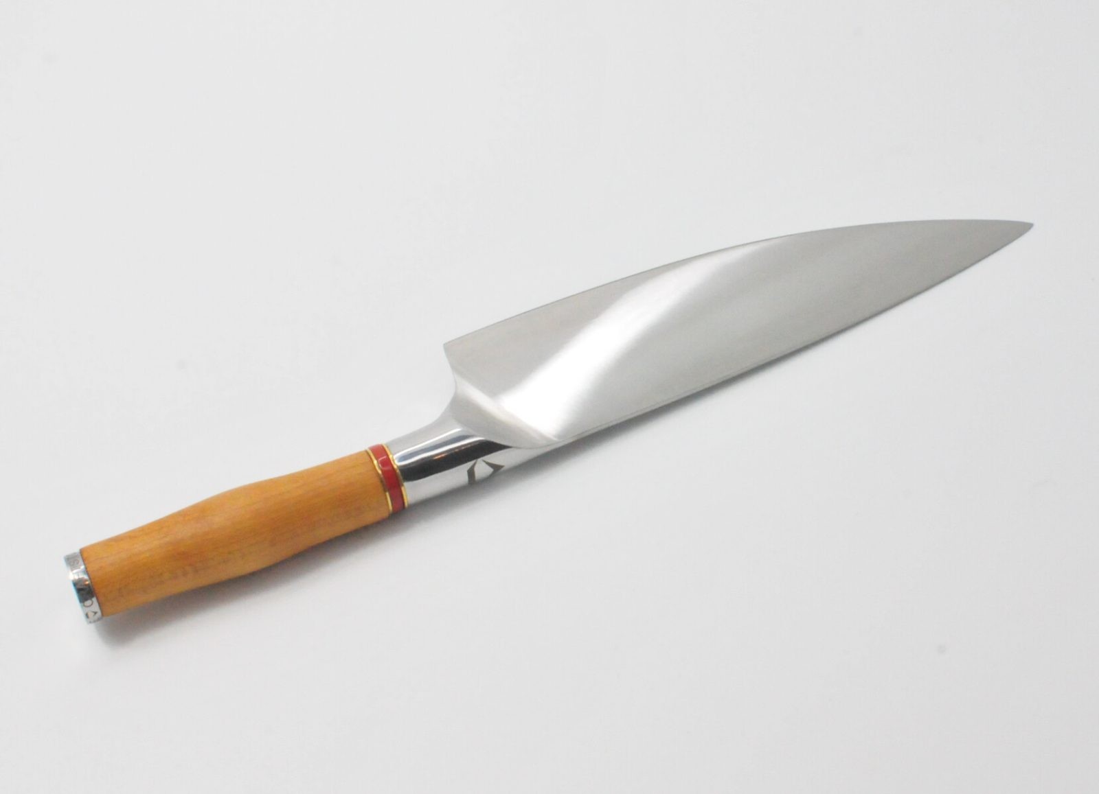 8 Inch Chef Knife with a Torrefied Maple Handle, a Garnet Colored Cubic Zirconia Stone at the Back of the Knife and Brass and Red Jasper Decorative Rings