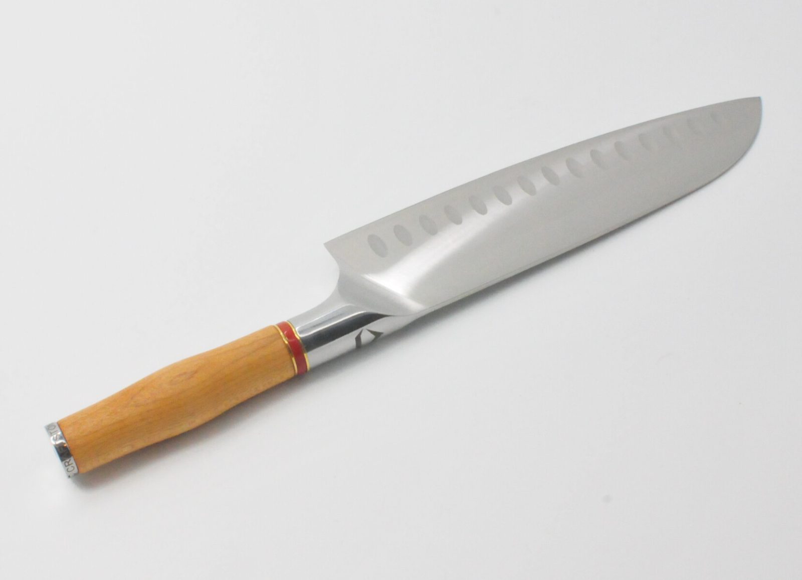 8 Inch Santoku Knife with a Torrefied Maple Handle, a Garnet Colored Cubic Zirconia Stone at the Back of the Knife and Brass and Red Jasper Decorative Rings