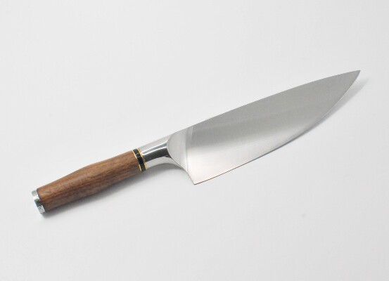 https://www.craftstoneknives.com/wp-content/uploads/2019/10/8-Inch-Chef-Knife-with-a-Black-Walnut-Handle-Black-Cubic-Zirconia-Stone-at-the-Back-of-the-Knife-and-Brass-and-Black-Onyx-Decorative-Rings.jpg