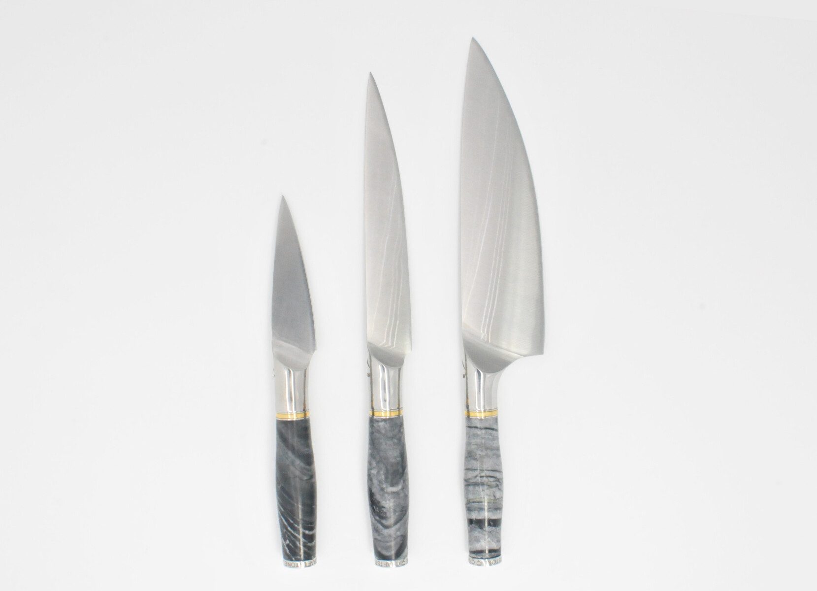 https://www.craftstoneknives.com/wp-content/uploads/bfi_thumb/3-Knife-set-with-a-Ancient-Wood-Vein-Marble-Handle-a-Champagne-Cubic-Zirconia-Stone-at-the-Back-of-the-Knife-and-Brass-and-Stainless-Steel-Decorative-Rings-3jbc8qnnkp92bw0q09y6tm.jpg